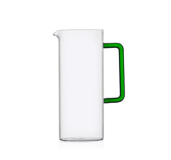 Decorative tube water jug made of glass with a green handle. 