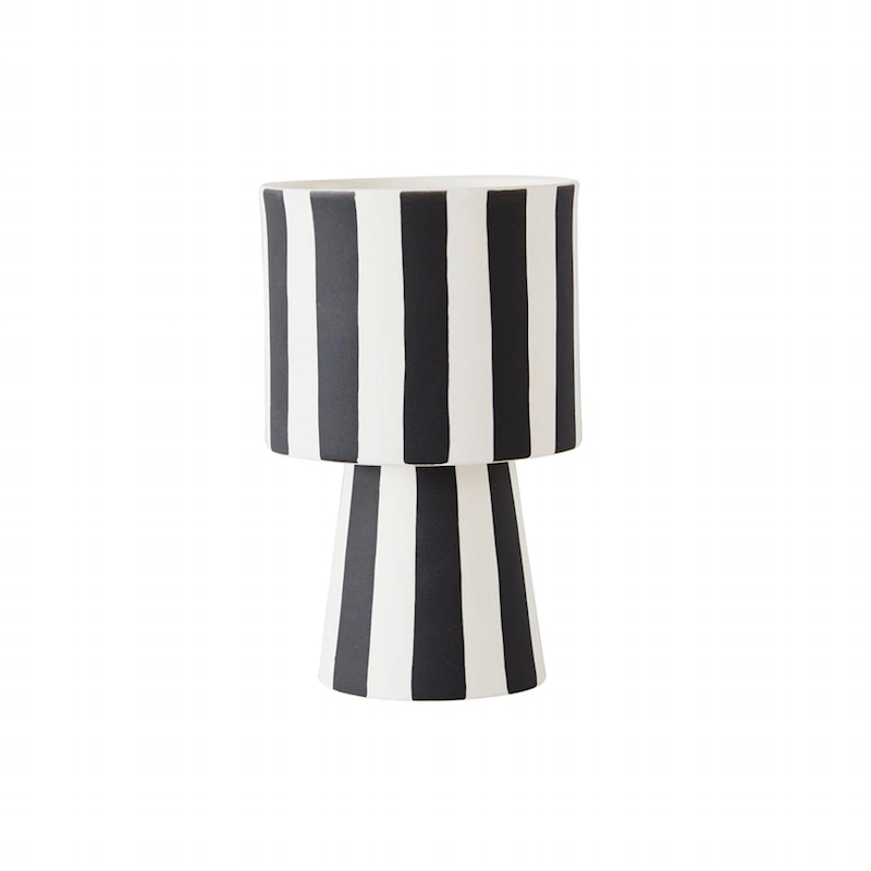 Ceramic flower vase with black and white stripes.