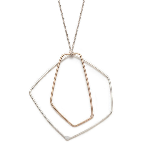 Sterling silver and 10k gold necklace with a silver chain designed by Gabrielle Desmarais.
